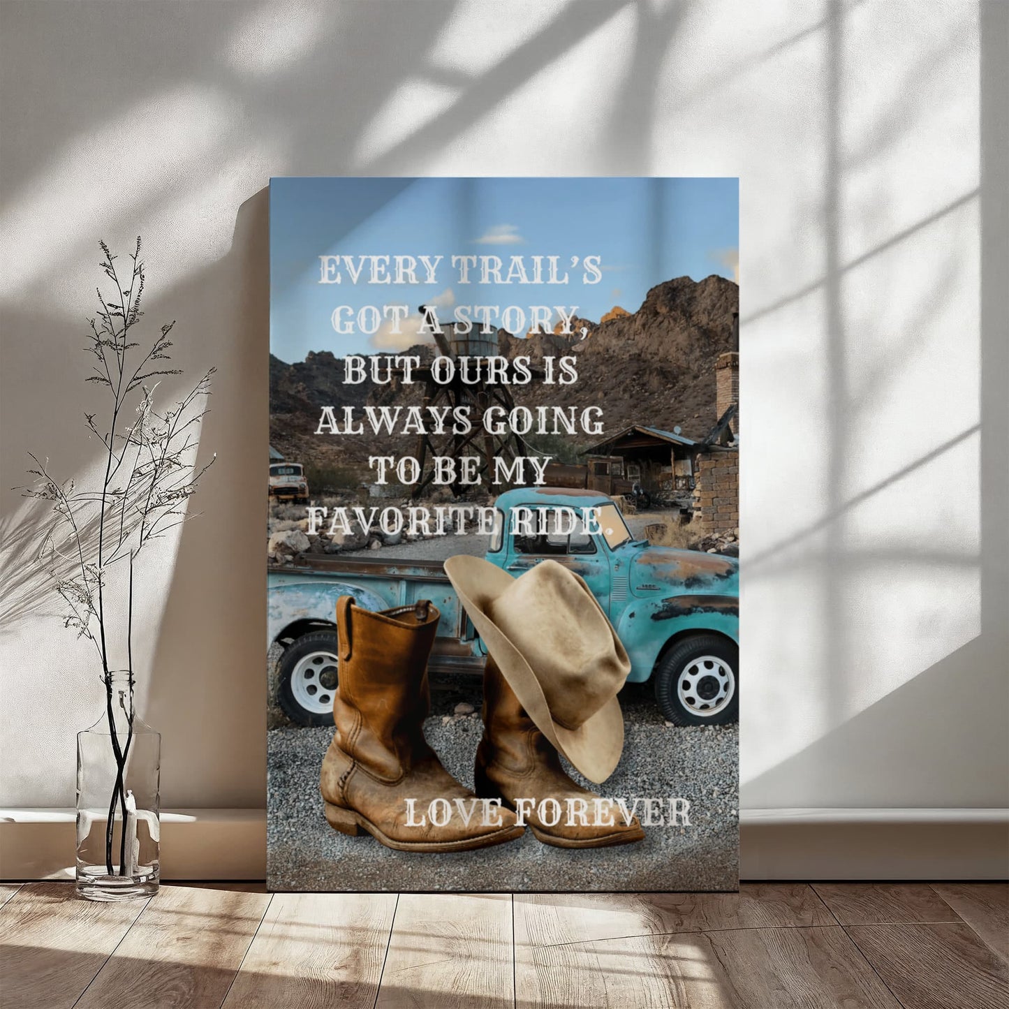 Canvas with cowboy boots, hat, and vintage truck in a desert scene with motivational quote.