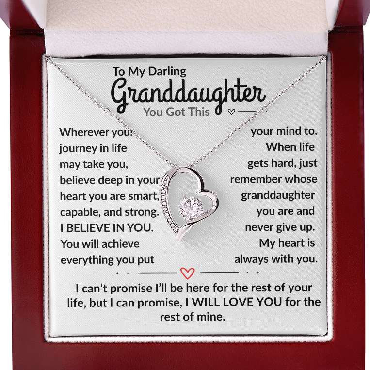 Card with message to granddaughter and heart-shaped pendant in a red box