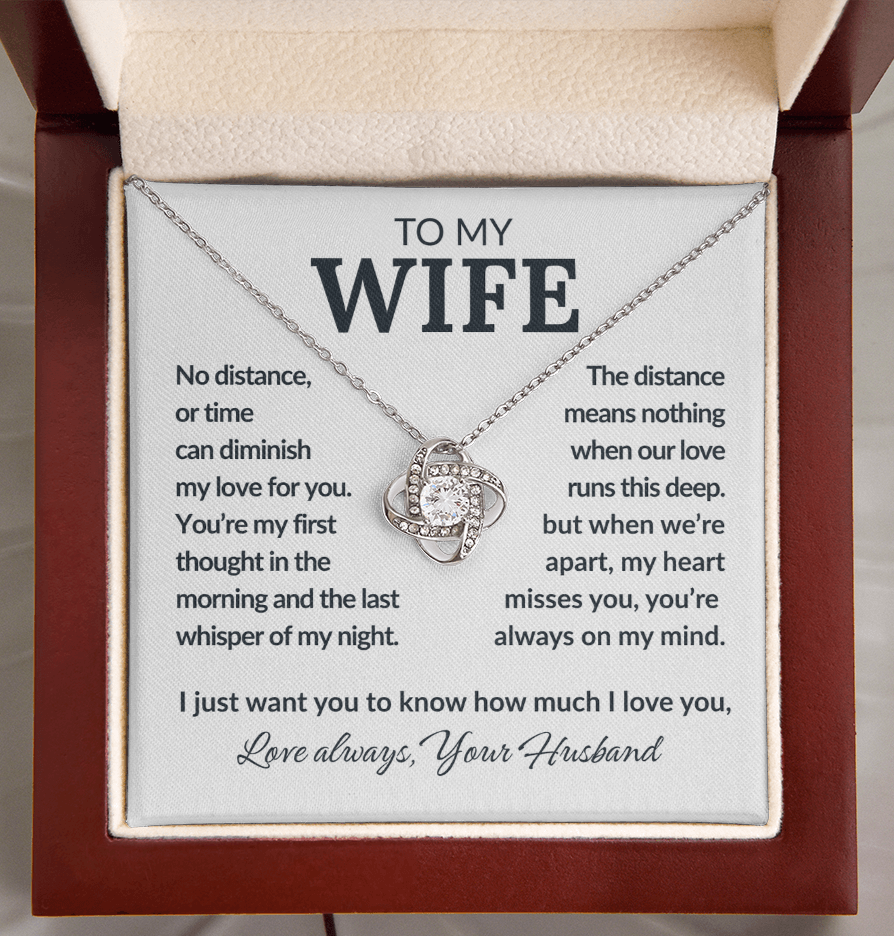 Necklace with a sentimental message card for a wife, placed in a box.