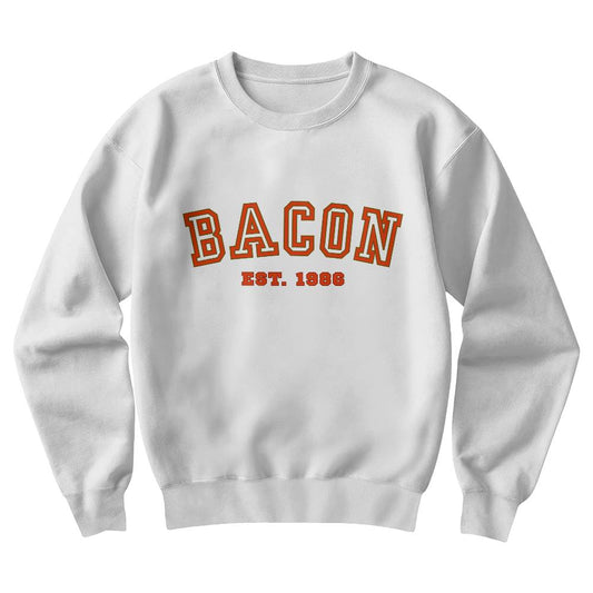 White sweatshirt with 'BACON EST. 1986' text in red on a white background